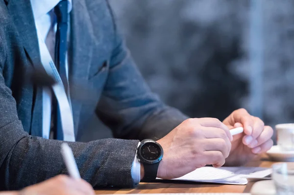 Close up of business people taking notes — Stock Photo, Image