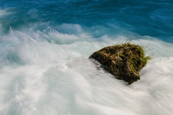 Single stone in wild river — Stock Photo, Image