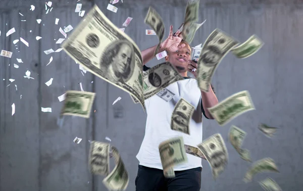 Black businessman making the rain of money — Stock Photo, Image