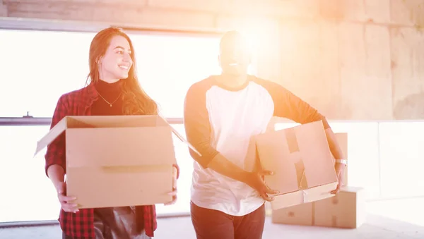 Multiethnic business team carrying cardboard boxes — Stock Photo, Image