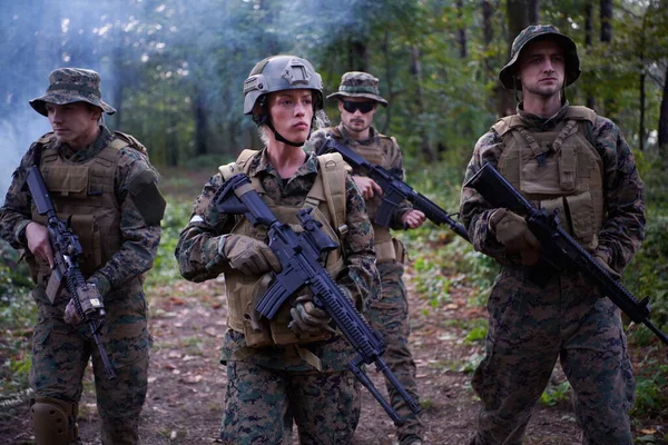 Modern Warfare Soldiers Squad Running in Tactical Battle Formation Woman as a Team Leader