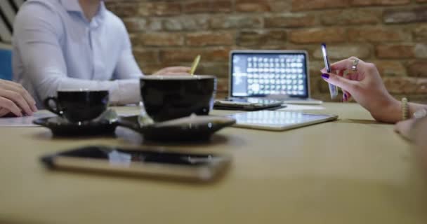 Business people enjoy and work in a cafe, business meeting in cafe — Stock Video