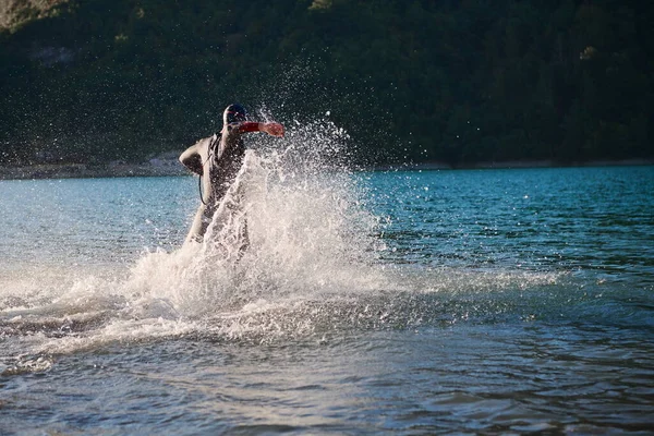 Triathlon athlete starting swimming training on lake — Stock Photo, Image