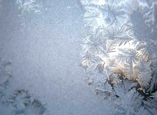 Frosty Pattern Glass Winter Window Stock Image