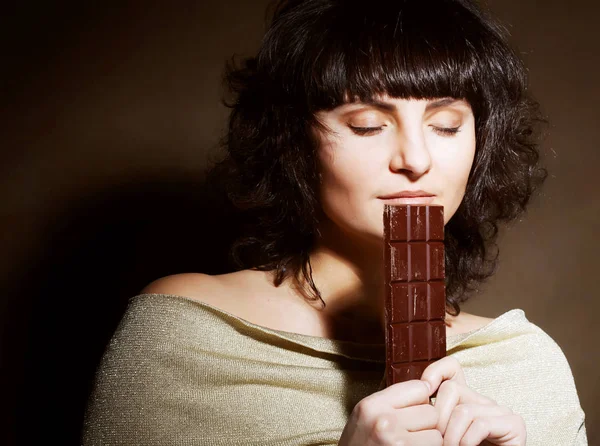 Portrait of beautiful woman with a chocolate — Stock Photo, Image