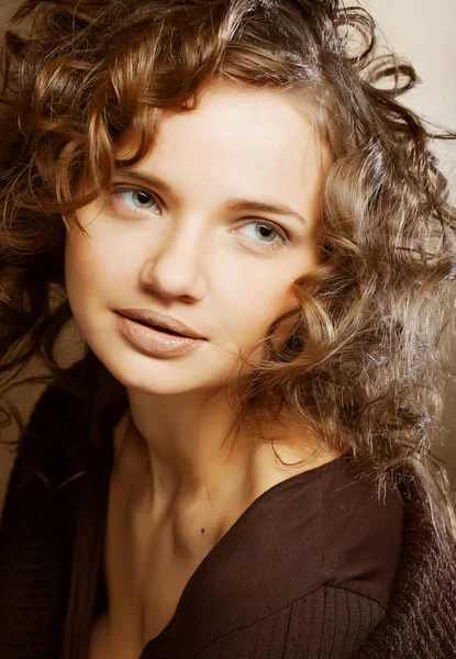 Beautiful young woman with curly hair — Stock Photo, Image