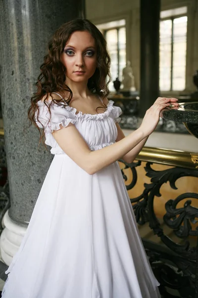 Beautiful young victorian lady in white dress — Stock Photo, Image
