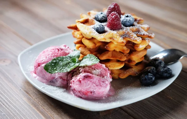 Plate of belgian waffles with ice cream and fresh berries - raspberries and blueberries — Stock Photo, Image