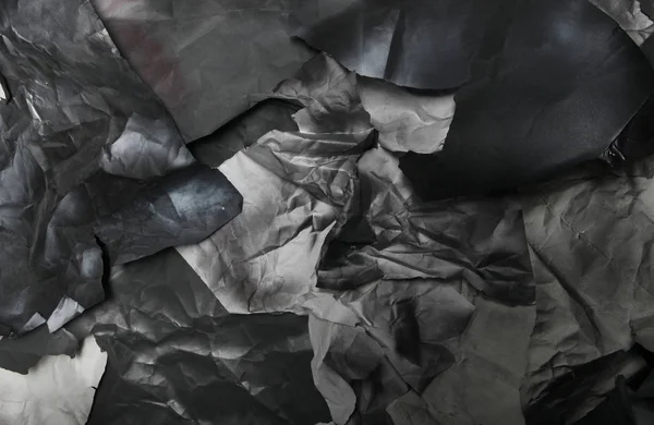 Monochrome background of torn pieces of black and white paper — Stock Photo, Image