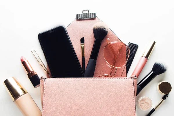 Flat lay of pink leather woman bag open out with cosmetics, acce — Stock Photo, Image