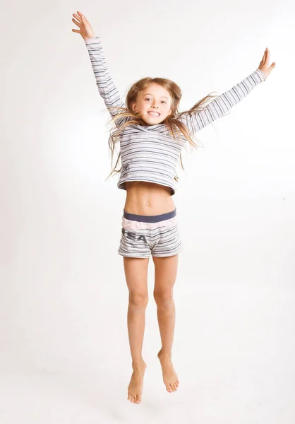 Girl jumps on a white background — Stock Photo, Image