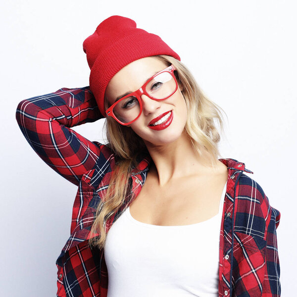 fashion portrait of trendy casual young woman wearing red glasses