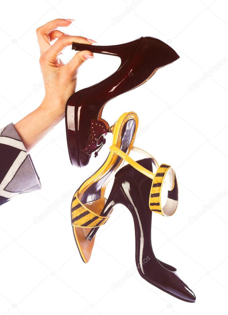 Shoes in womans hand