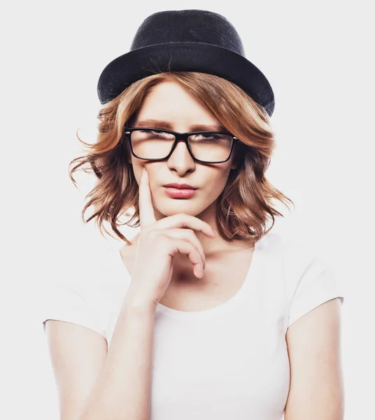 Happy  young student woman  in fashion glasses and black  hat on white background — Stock Photo, Image