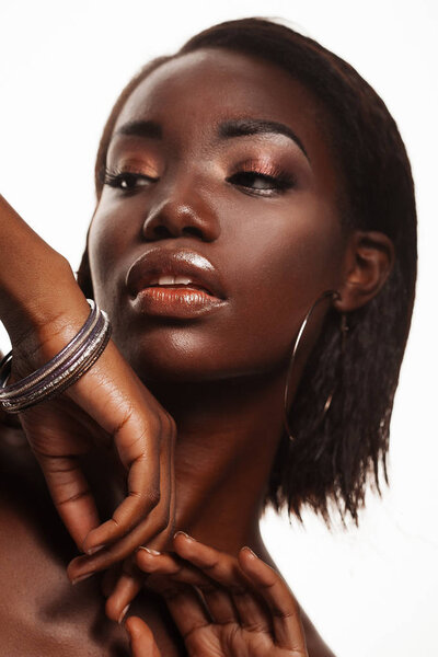 Fashion and beauty concept: attractive african american woman closeup portrait, studio shoot