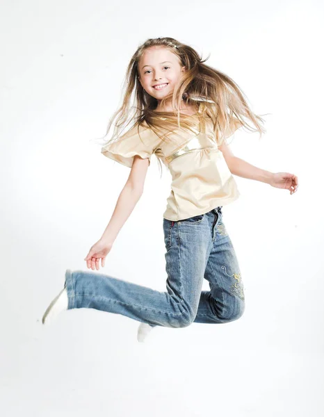 Little girl jump over white background — Stock Photo, Image