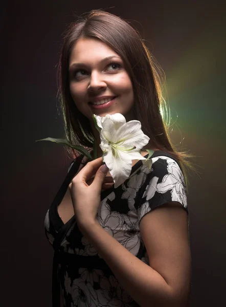 Beautiful woman with madonna lily — Stock Photo, Image