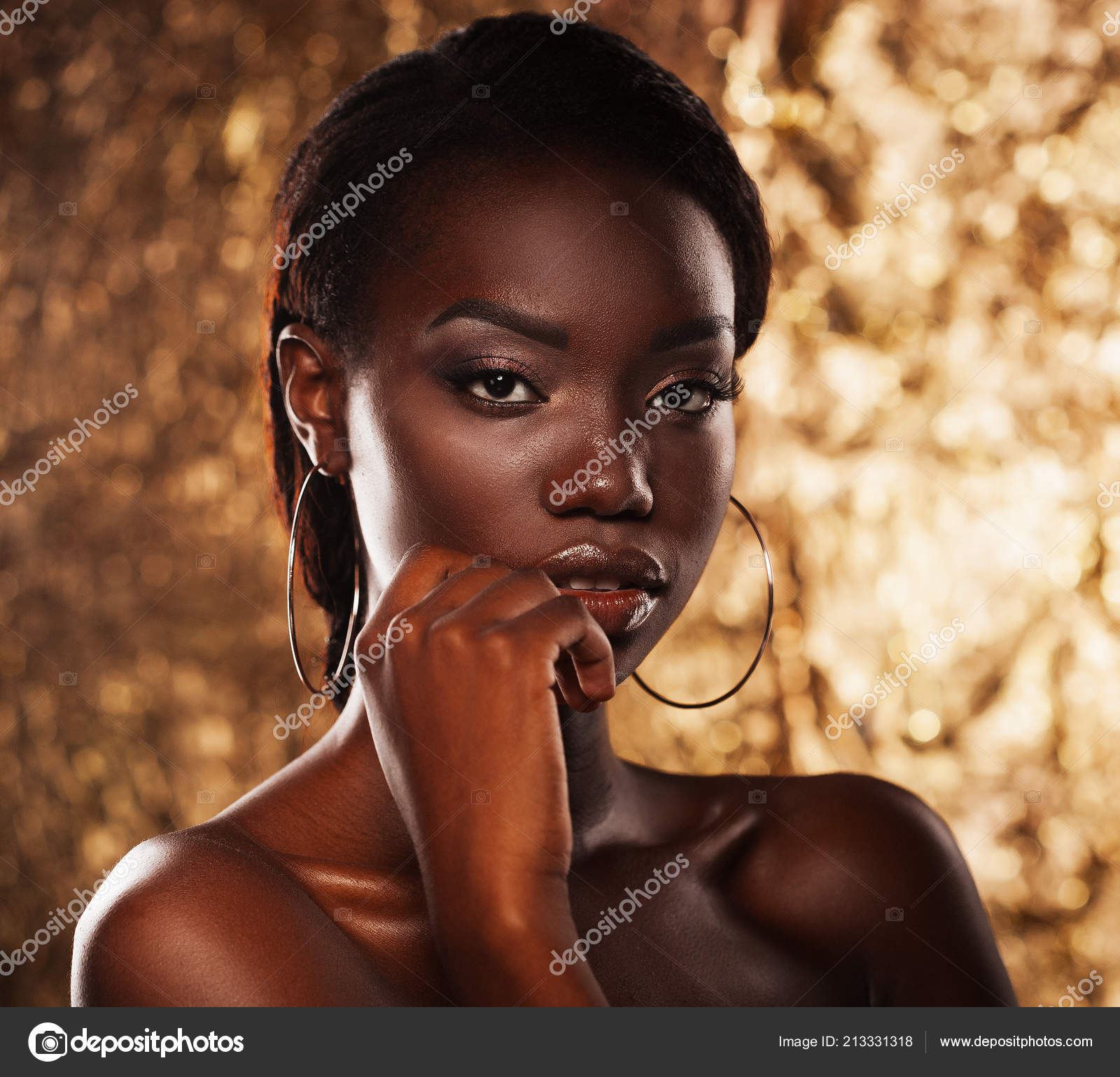 Stunning Portrait of an African American Black Woman over golden background  Stock Photo by ©kanareva 213331318