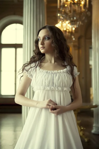 Portrait of a beautiful young victorian lady in white dress — Stock Photo, Image