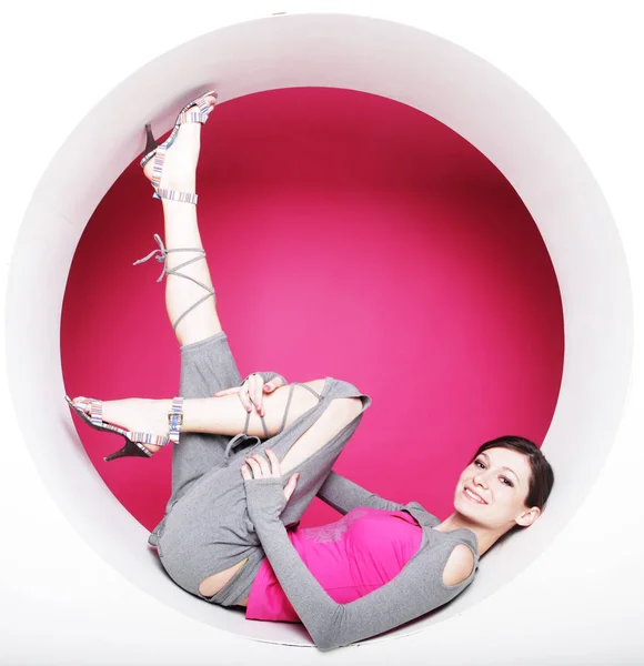 Woman posing in pink circle — Stock Photo, Image