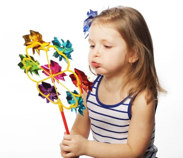 Menina com brinquedo colorido — Fotografia de Stock