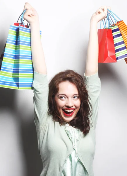 Woman with colored shopping bags — Stock Photo, Image