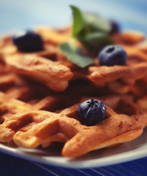 Homemade belgian waffles with fresh blueberry and raspberry over wooden background. Top view. — Stock Photo, Image