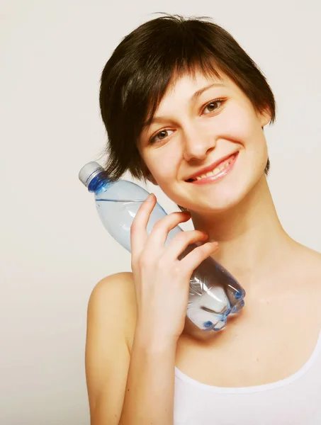 Woman with bottle of clean water — Stock Photo, Image