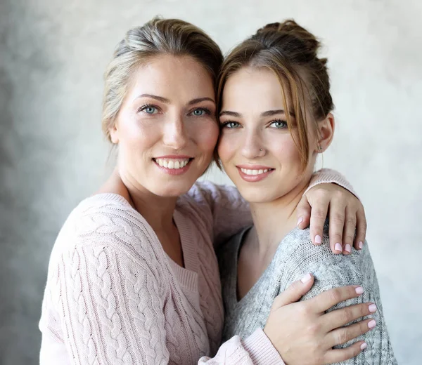 Happy senior mother embracing adult daughter laughing together — Stock Photo, Image