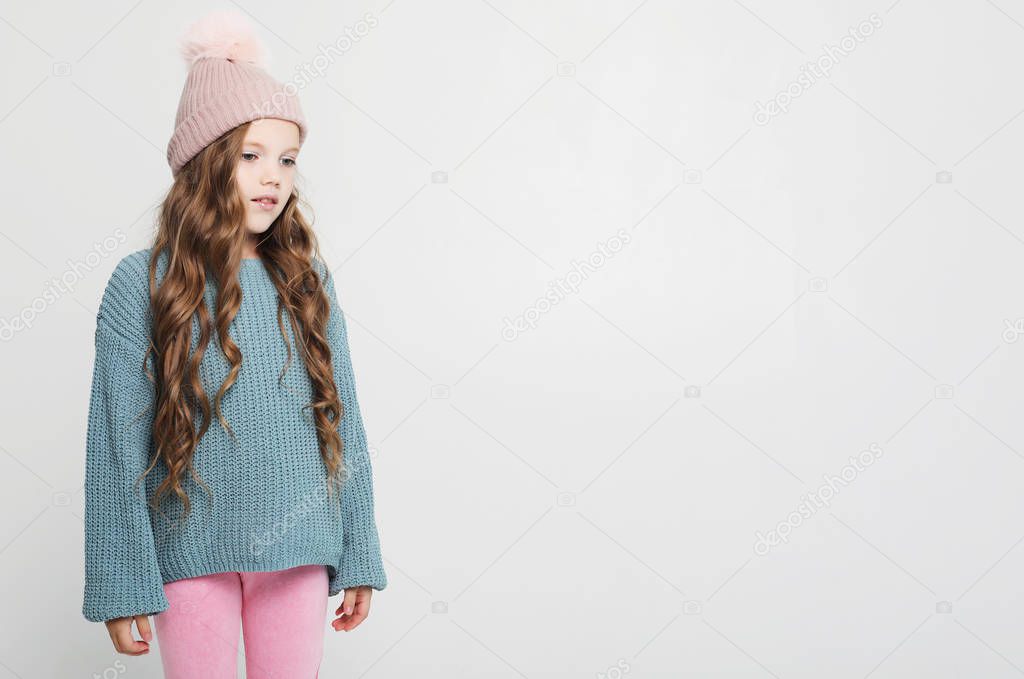 Charming happy young girl. Portrait of pleased carefree adorable daughter with blond hair wearing casual