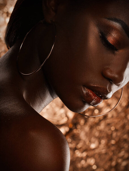 Portrait of Young African model with a beautiful makeup in studio.Close up.