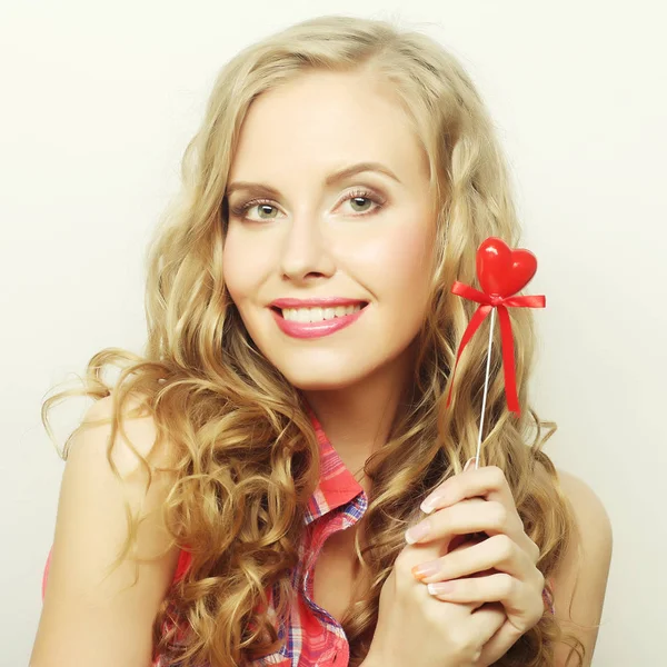 Blond  woman with little red heart — Stock Photo, Image