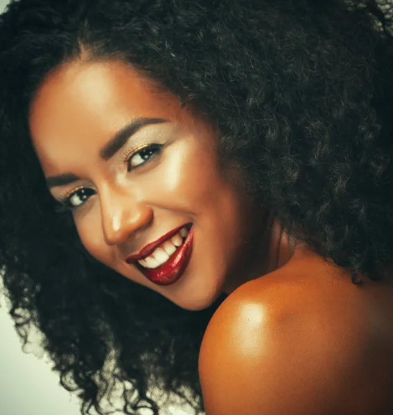 Beauty portrait of attractive african american woman with big afro and glamour makeup.