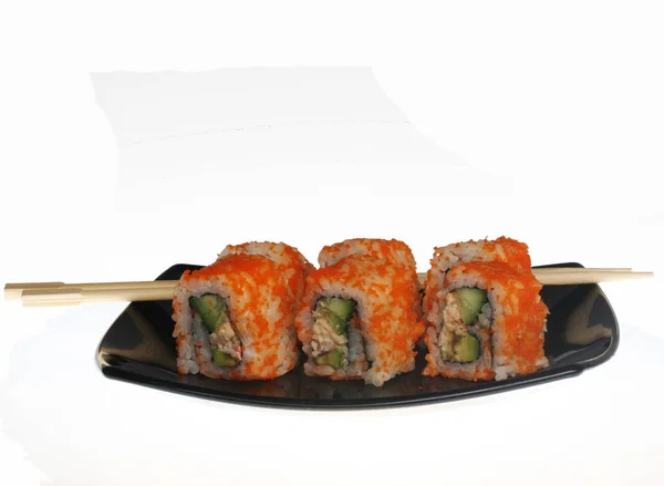 Japanese  rolls on black plate. — Stock Photo, Image