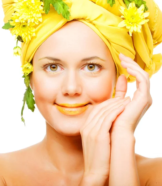 Image of a young woman with yellow chrysanthemums — Stock Photo, Image