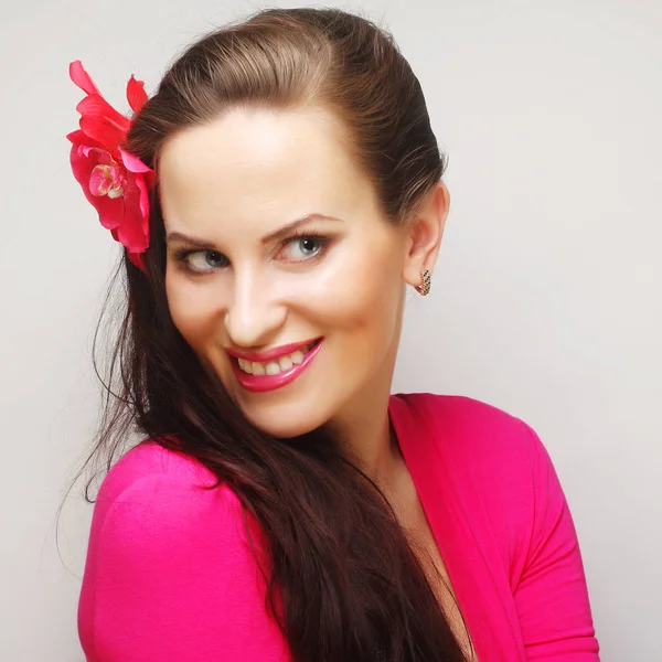 Brunette with long hair in pink wear happy smiling — Stock Photo, Image