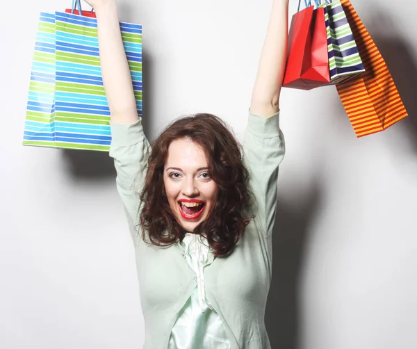 Mujer con bolsas de compras de colores —  Fotos de Stock