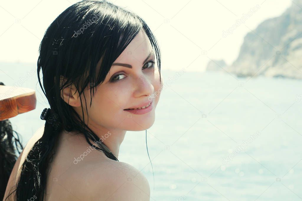 lovely brunette woman at the sea
