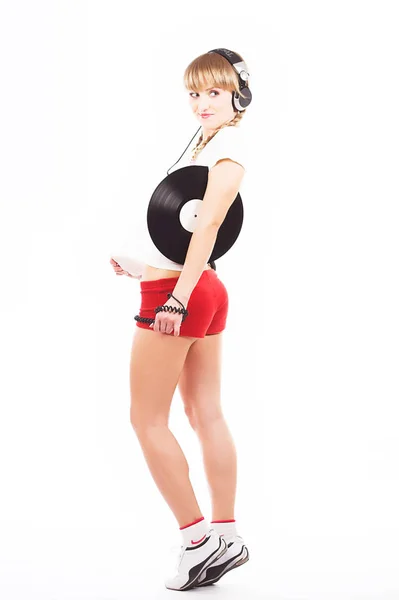 Rubia coqueta, deportiva con un disco y auriculares —  Fotos de Stock