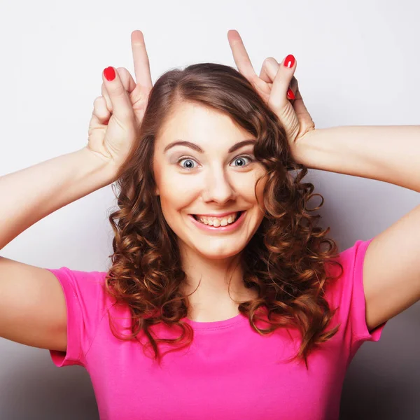 Funny woman doing hand sign — Stock Photo, Image