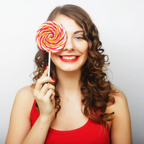Young sexual woman holding lollipop. — Stock Photo, Image