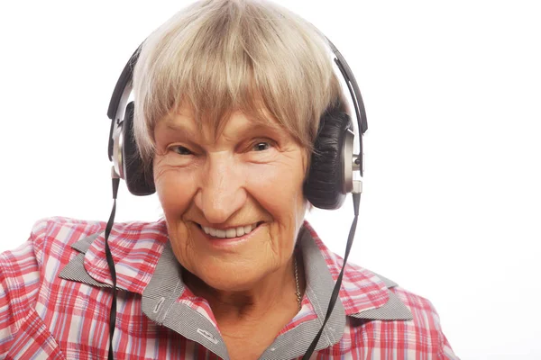 Portrait of senior woman listening to music — Stock Photo, Image