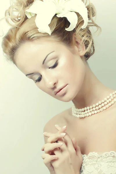 Girl with a flower in her hair — Stock Photo, Image