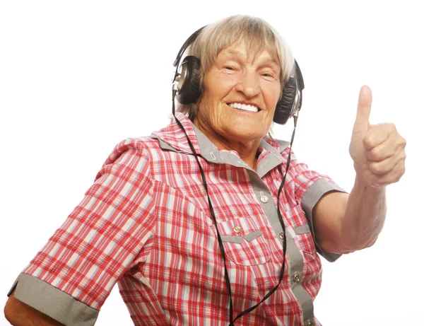 Funny old lady listening music — Stock Photo, Image