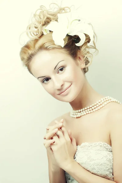 Girl with a flower in her hair — Stock Photo, Image