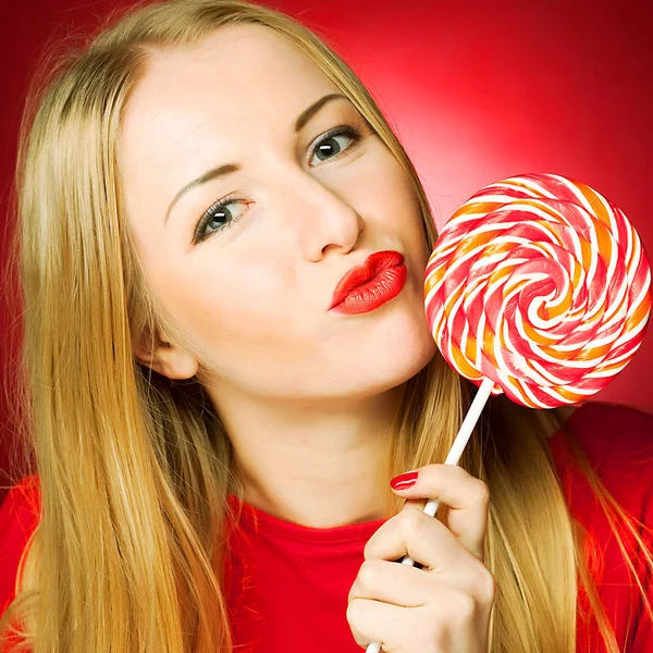 Woman holding lollypop — Stock Photo, Image