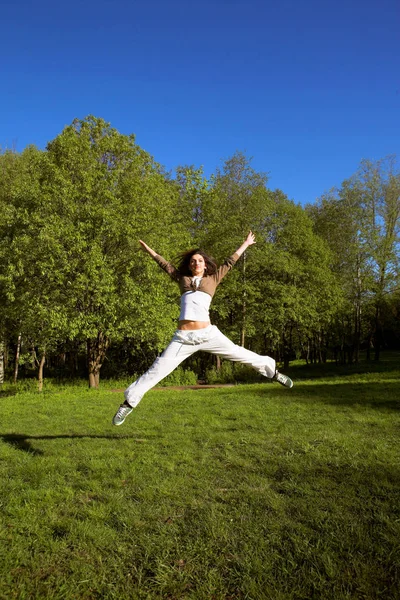 Slim shaped beautiful girl jumping — Stock Photo, Image