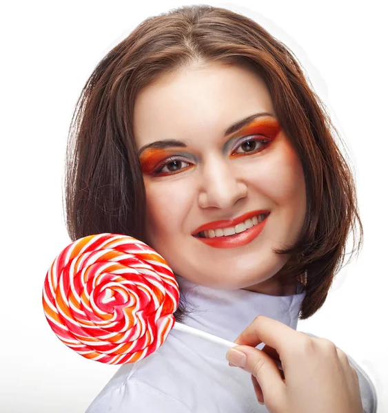 Bardzo młoda kobieta trzymając lolly pop. — Zdjęcie stockowe