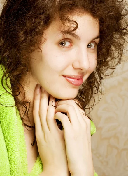 Young smiling woman in bathrobe — Stock Photo, Image