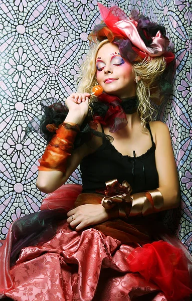 Girl with  with creative make-up holds  lollipop — Stock Photo, Image